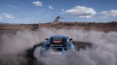 A Blue Car With A Sticker On The Back That Says ' Racing ' On It GIF
