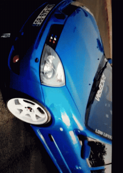 A Blue Car With A Sticker That Says Low Lifes GIF