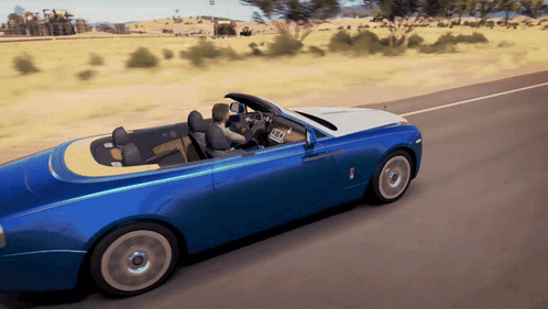 A Blue Car With A Yellow Top Is Driving Down A Road GIF