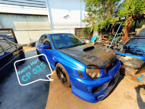 A Blue Car With Racing Hart Cp 035 On The Front GIF