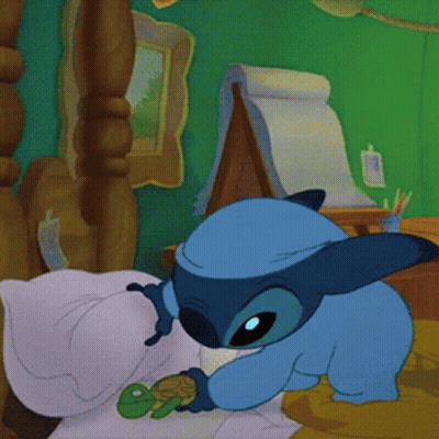 A Blue Cartoon Character Is Holding A Small Green Frog GIF