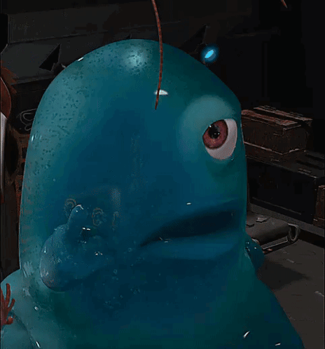 A Blue Cartoon Character With A Big Eye Looks At The Camera GIF