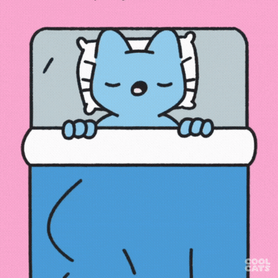 A Blue Cat Is Sleeping In A Bed With A Pillow GIF