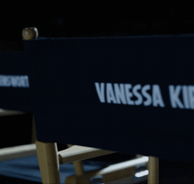 A Blue Director 'S Chair With Vanessa Kirby Written On It GIF