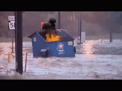A Blue Dumpster With The Word Rescue On It Is Floating In The Water GIF