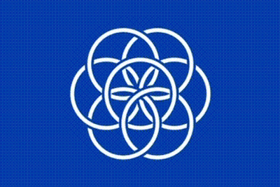 A Blue Flag With A White Flower On It . GIF
