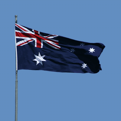 A Blue Flag With Red White And Blue Stars Is Flying In The Wind GIF