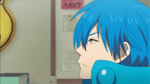 A Blue Haired Anime Character Is Standing In Front Of A Calendar GIF