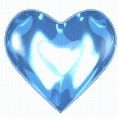 A Blue Heart On A White Background That Looks Like A Sapphire GIF