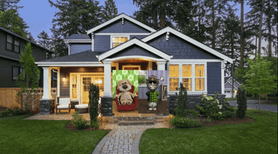 A Blue House With Two Stuffed Animals In Front GIF