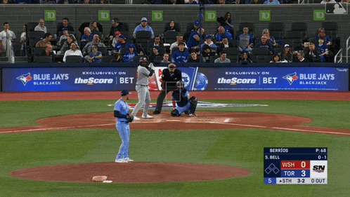 A Blue Jays Baseball Game Is Being Played In Front Of A Crowd GIF