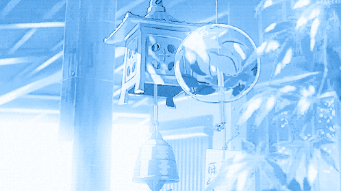 A Blue Lantern With A Bell Hanging From It And A Globe Hanging From It GIF