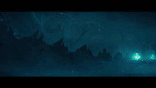 A Blue Light Is Coming Out Of A Cave In The Dark GIF