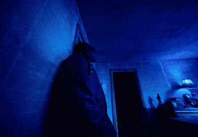 A Blue Light Is Shining On A Dark Blue Background GIF