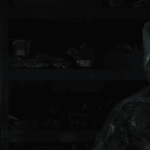 A Blue Light Is Shining Through A Dark Plastic Bag GIF