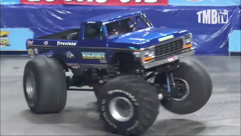 A Blue Monster Truck With The Word Firestone On It GIF