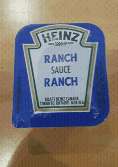 A Blue Packet Of Heinz Ranch Sauce On A Table GIF