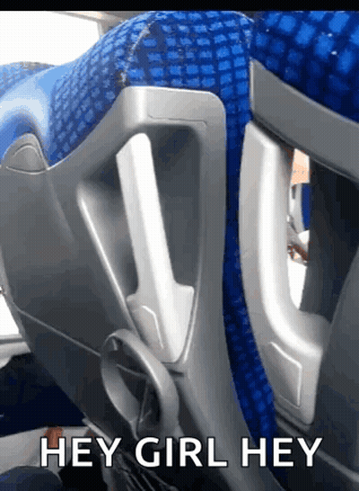 A Blue Seat On A Bus With The Words Hey Girl Hey GIF