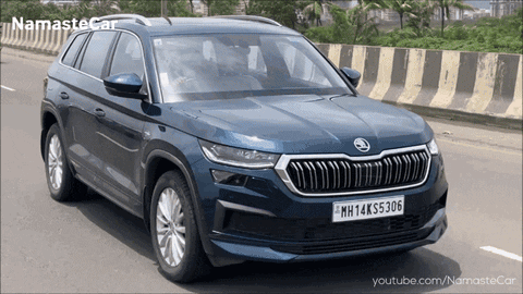 A Blue Skoda Car With A License Plate That Says Mh14k55306 GIF