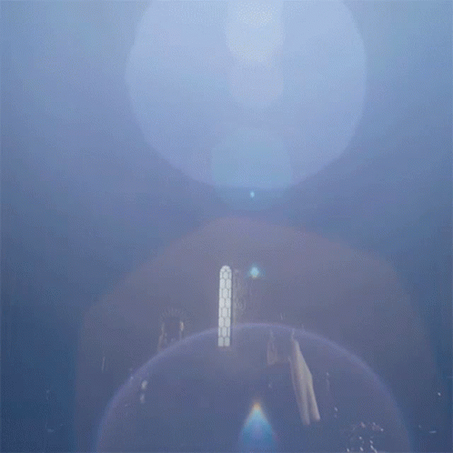 A Blue Sky With A Few Clouds And A Few Lights GIF