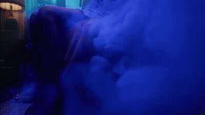 A Blue Smoke Filled Room With The Words " I Feel The Lavender Haze " On The Bottom GIF