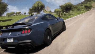 A Blue Sports Car Is Driving Down A Dirt Road With A California License Plate GIF