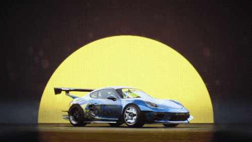 A Blue Sports Car Is Parked In Front Of A Yellow Light GIF