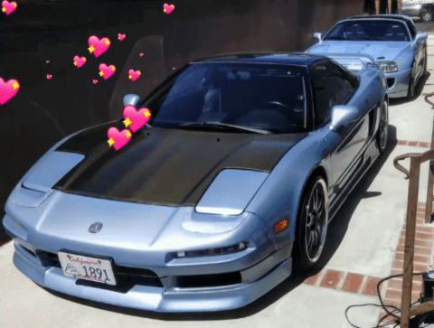 A Blue Sports Car With A California License Plate GIF
