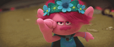 A Blue Stuffed Animal And A Pink Stuffed Animal Are Standing Next To Each Other In A Field . GIF