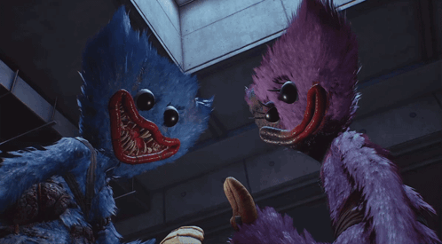 A Blue Stuffed Animal And A Purple Stuffed Animal Standing Next To Each Other GIF