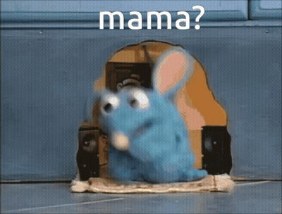 A Blue Stuffed Animal Is Sitting In A Hole With The Word Mama Written On It GIF