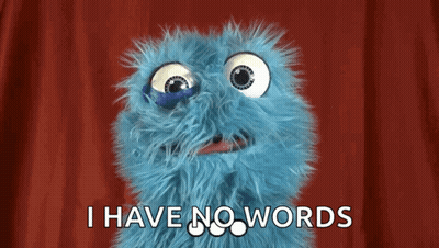 A Blue Stuffed Animal With Big Eyes Is Saying I Have No Words . GIF