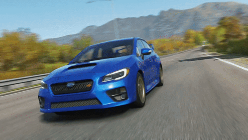 A Blue Subaru Is Driving Down The Road GIF