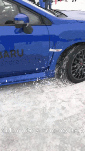 A Blue Subaru Is Driving Through The Snow GIF