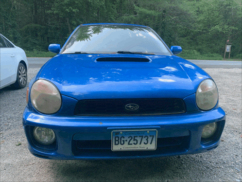 A Blue Subaru With A Virginia License Plate Bg-25737 GIF