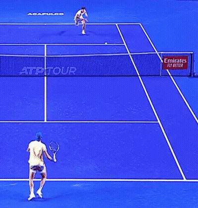 A Blue Tennis Court With A Emirates Fly Better Sign GIF