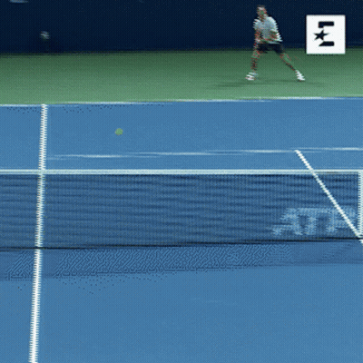 A Blue Tennis Court With A Sign That Says Western & Southern On It GIF