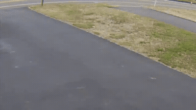 A Blue Trash Can Sits On The Side Of The Road Next To A Sign That Says The Weekend GIF