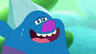 A Blue Troll With A Purple Nose And A White Hat Is Smiling GIF