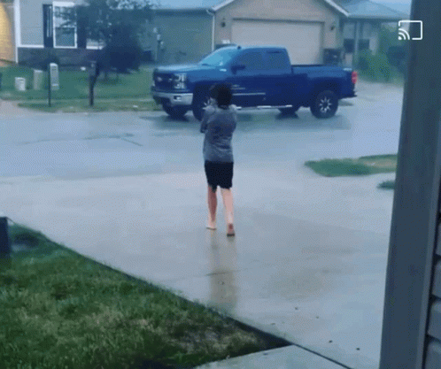 A Blue Truck Is Parked In Front Of A House GIF