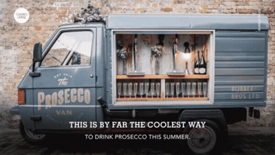 A Blue Van That Says The Prosecco Van On It GIF