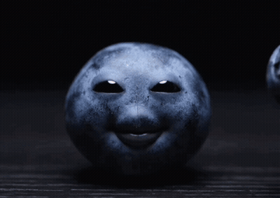 A Blueberry With A Face On It GIF