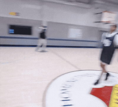 A Blurred Image Of A Basketball Court With A Sign That Says Lone Star GIF