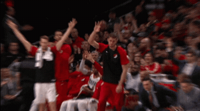 A Blurred Image Of A Basketball Game With Players Wearing Red And Black Jerseys With The Number 24 On Them GIF
