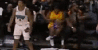 A Blurred Image Of A Basketball Player Standing On The Court . GIF