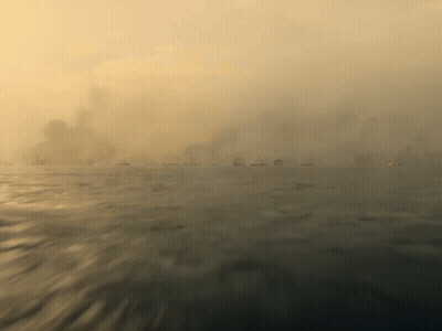 A Blurred Image Of A Body Of Water With A City In The Background GIF