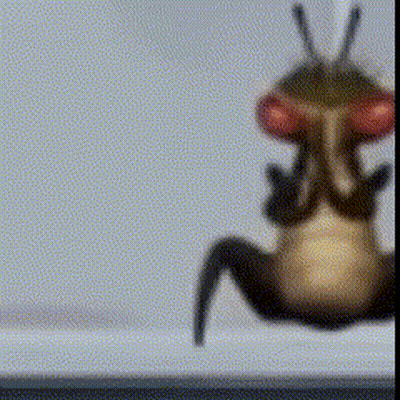 A Blurred Image Of A Bug With Red Eyes GIF