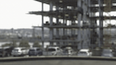 A Blurred Image Of A Building Under Construction GIF