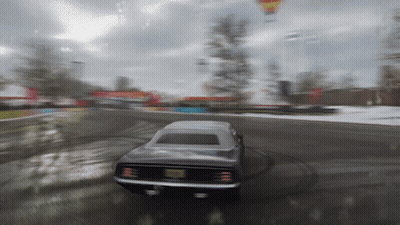 A Blurred Image Of A Car Driving Down A Road GIF