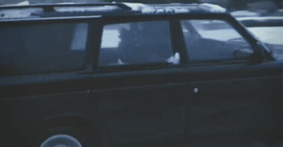A Blurred Image Of A Car Driving Down A Street GIF